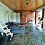 Гостевой дом Орешек, открытая терраса с двумя диванами и мангалом и всеми принадлежностями для барбек, фото 18